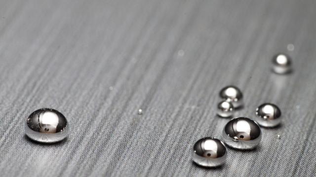 Shiney mercury drops on textured surface